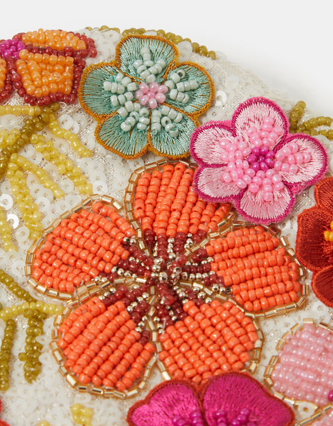 Close-up of the beadwork and flower motifs