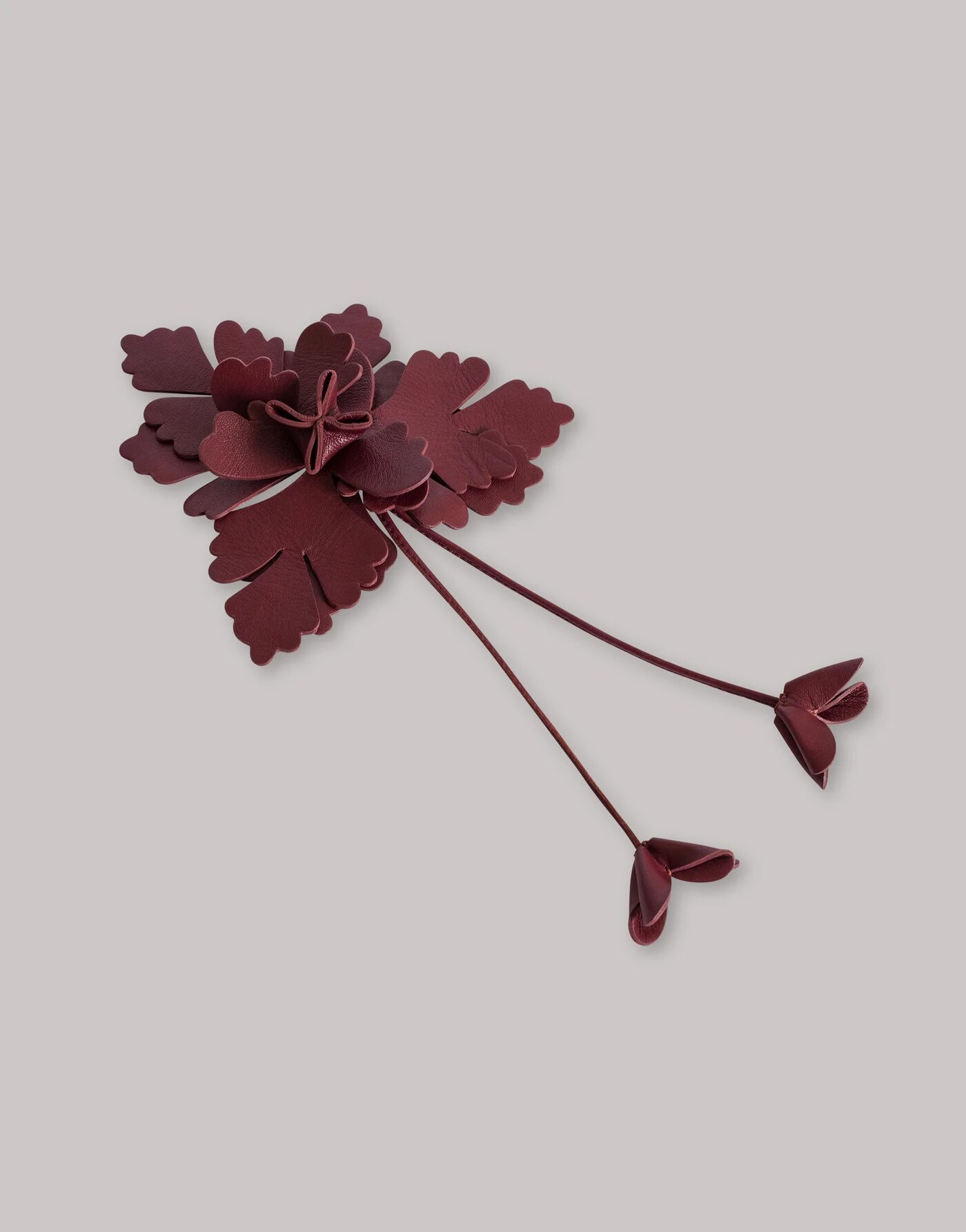 Leather flower brooch — profile view