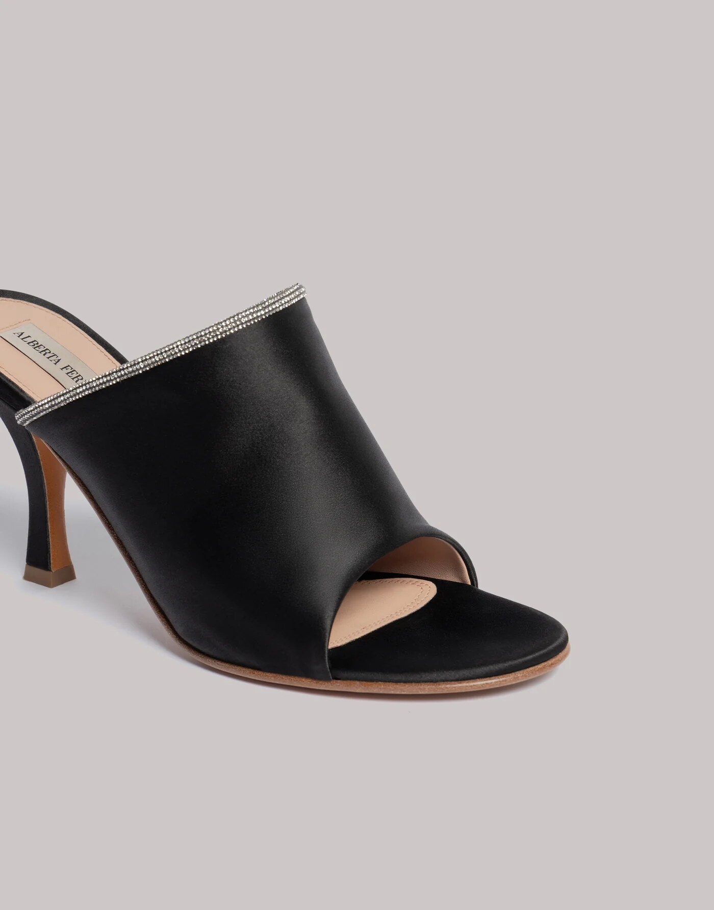 Satin mules with rhinestone trim — profile view
