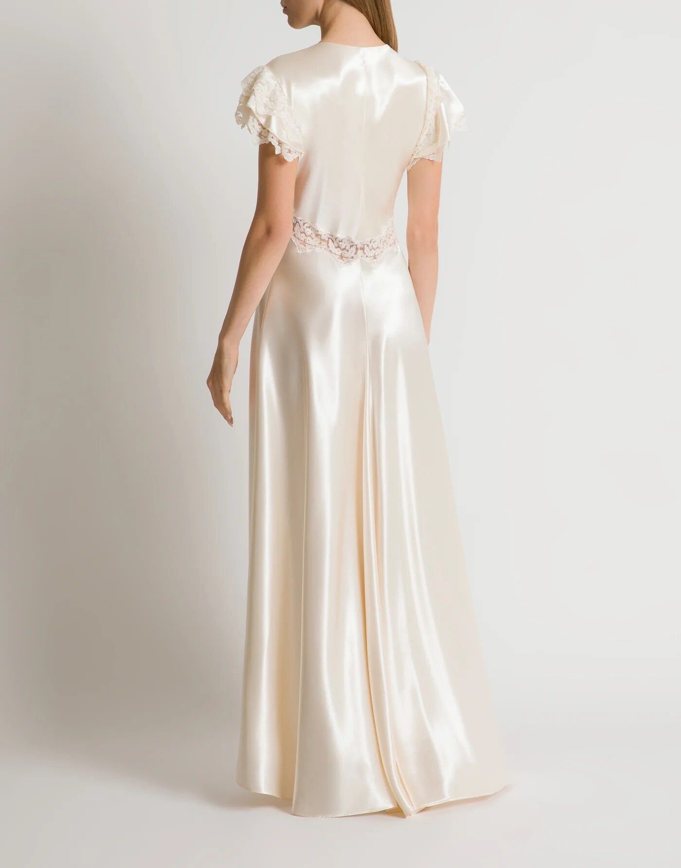 Satin dress with lace sleeves — profile view
