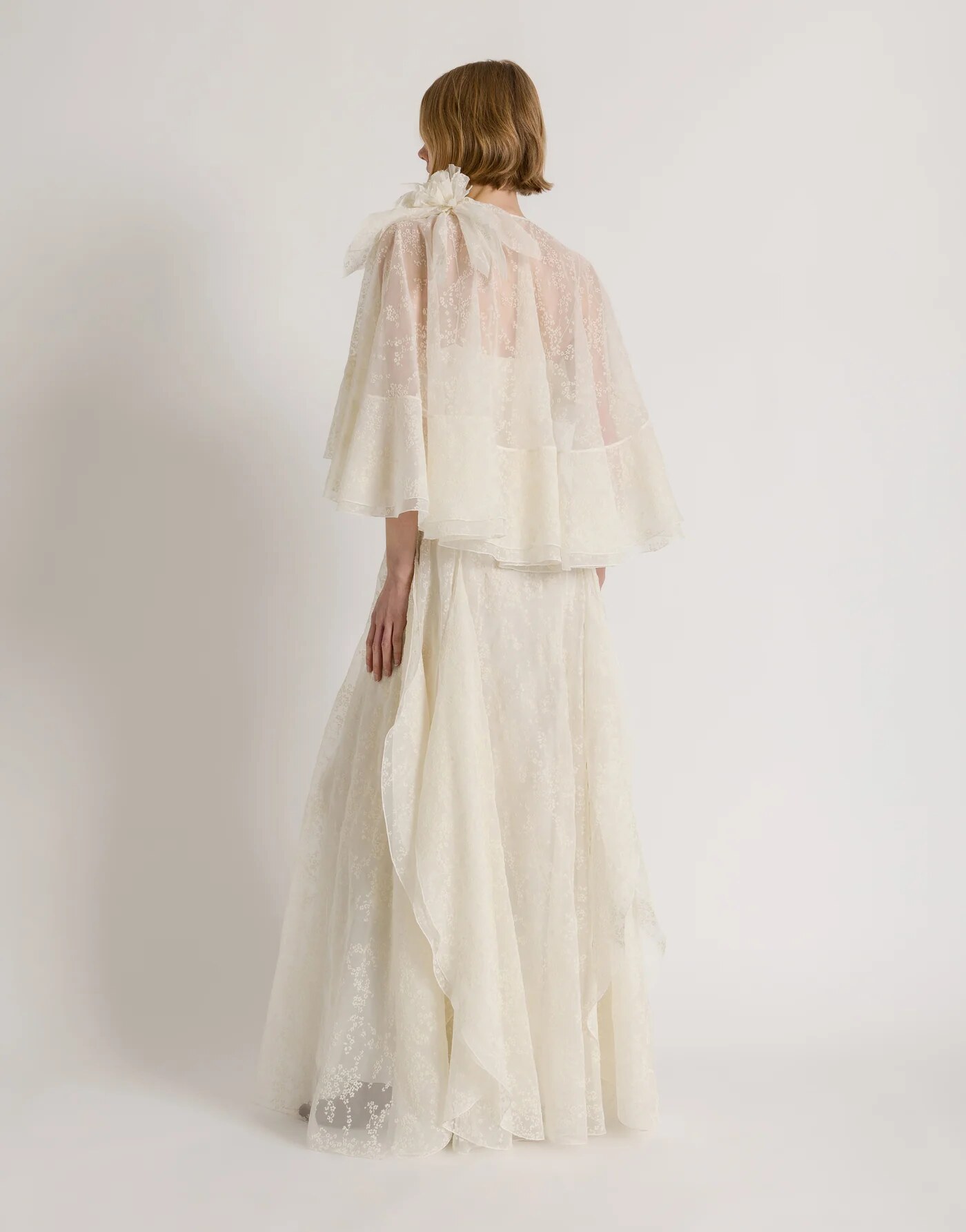Silk tulle gown with removable cape — profile view