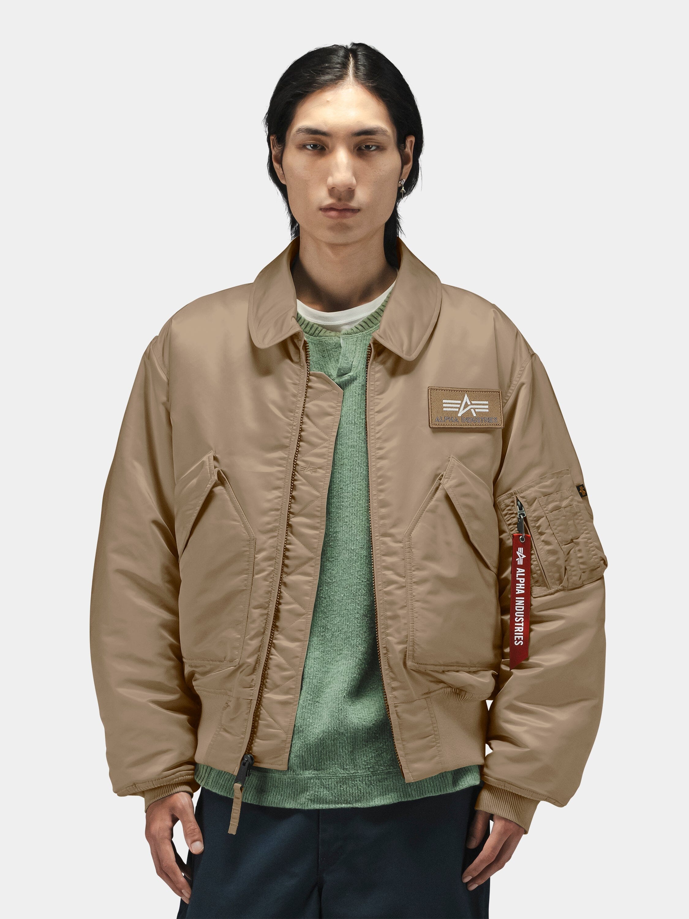 Side angle showing the rounded collar and flap pockets