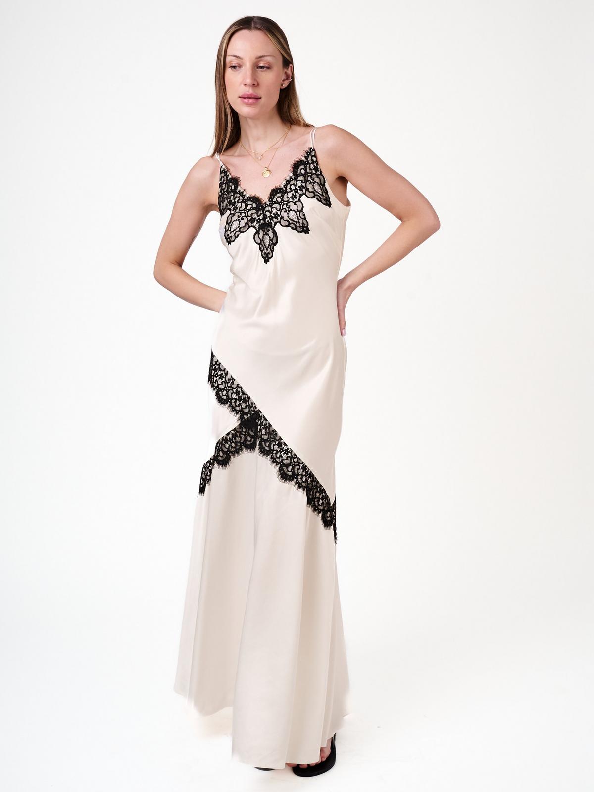 Full look showing the sleeveless tailored cut
