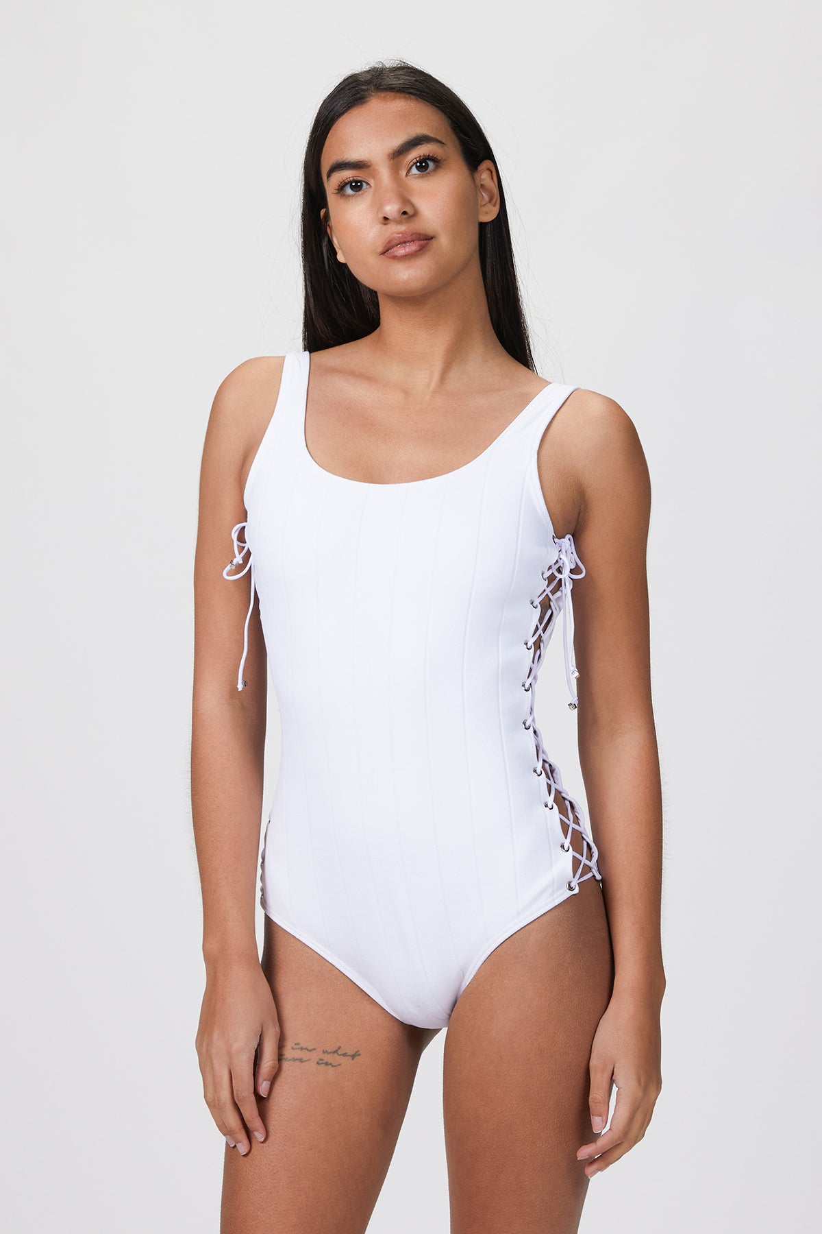on-body front view of the lace-up side ties