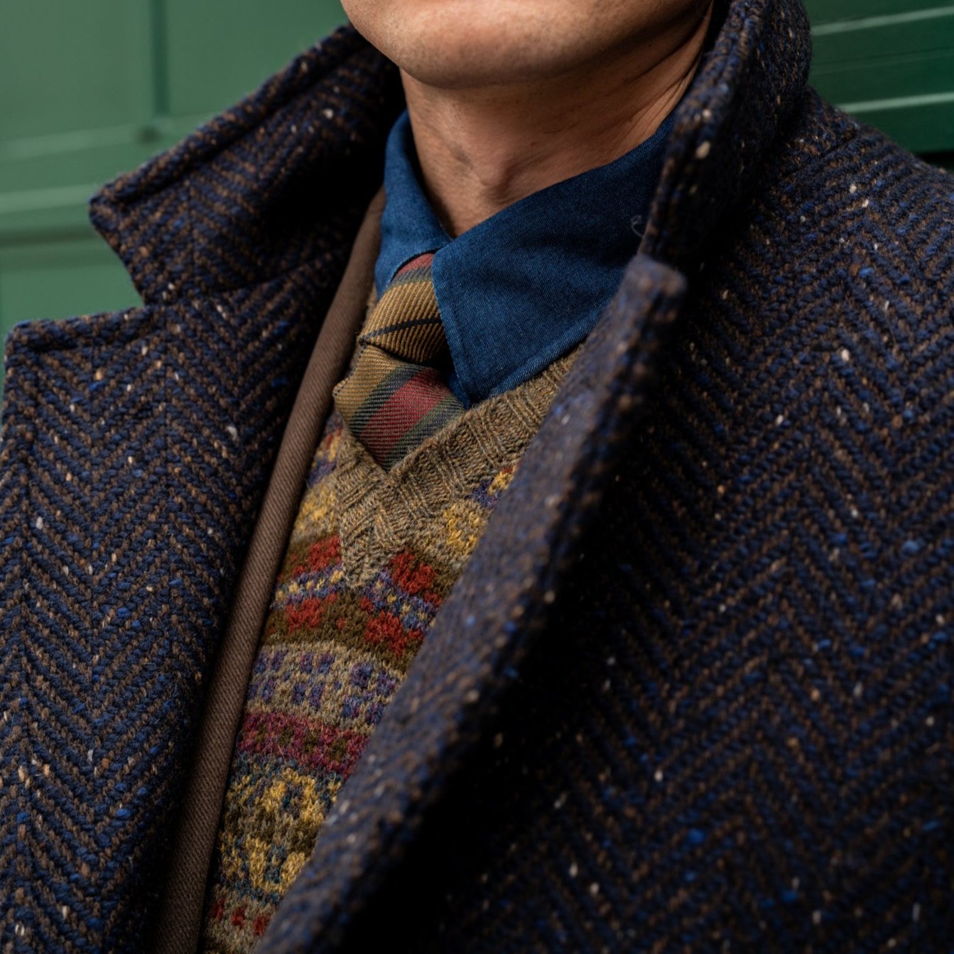 Overcoat worn with scarf