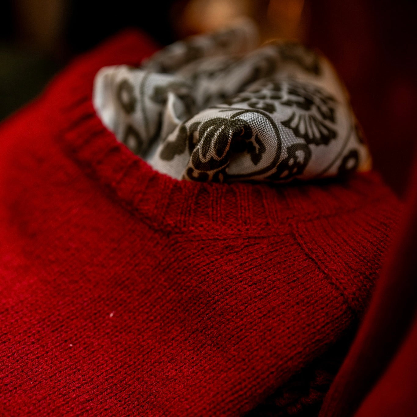 Styled closeup with scarf and red knit