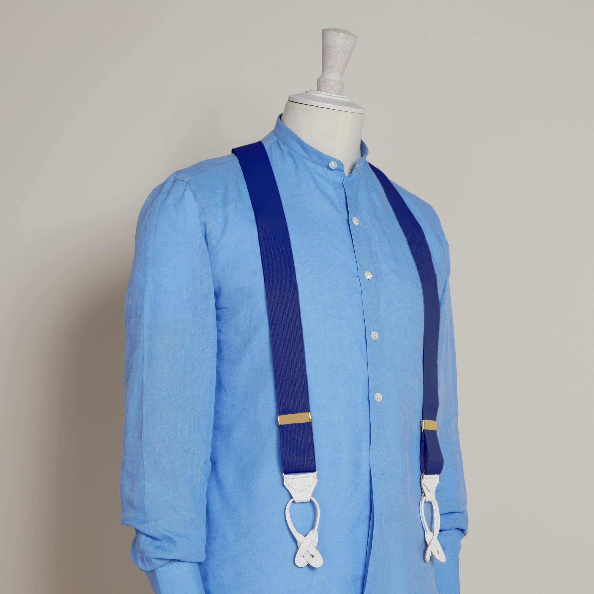 Braces worn with light-blue shirt