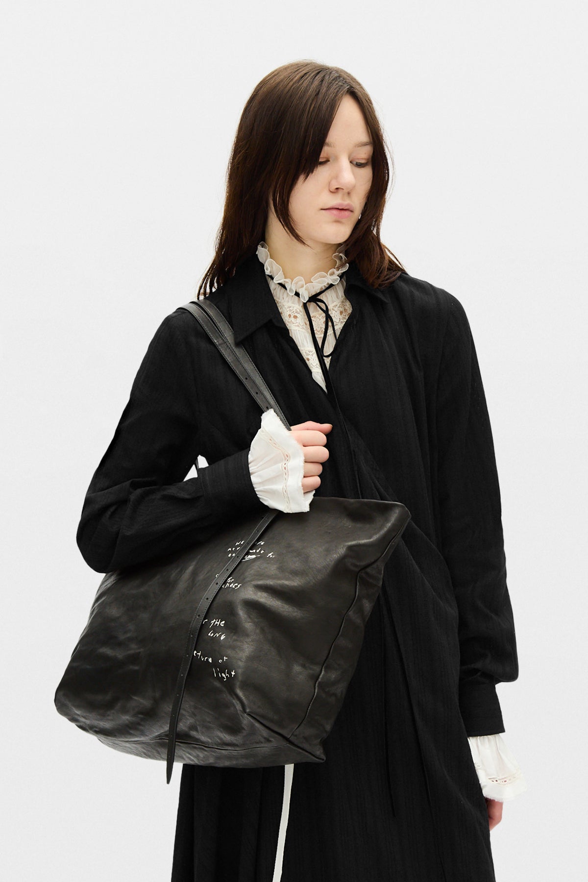 Tote carried over tailoring