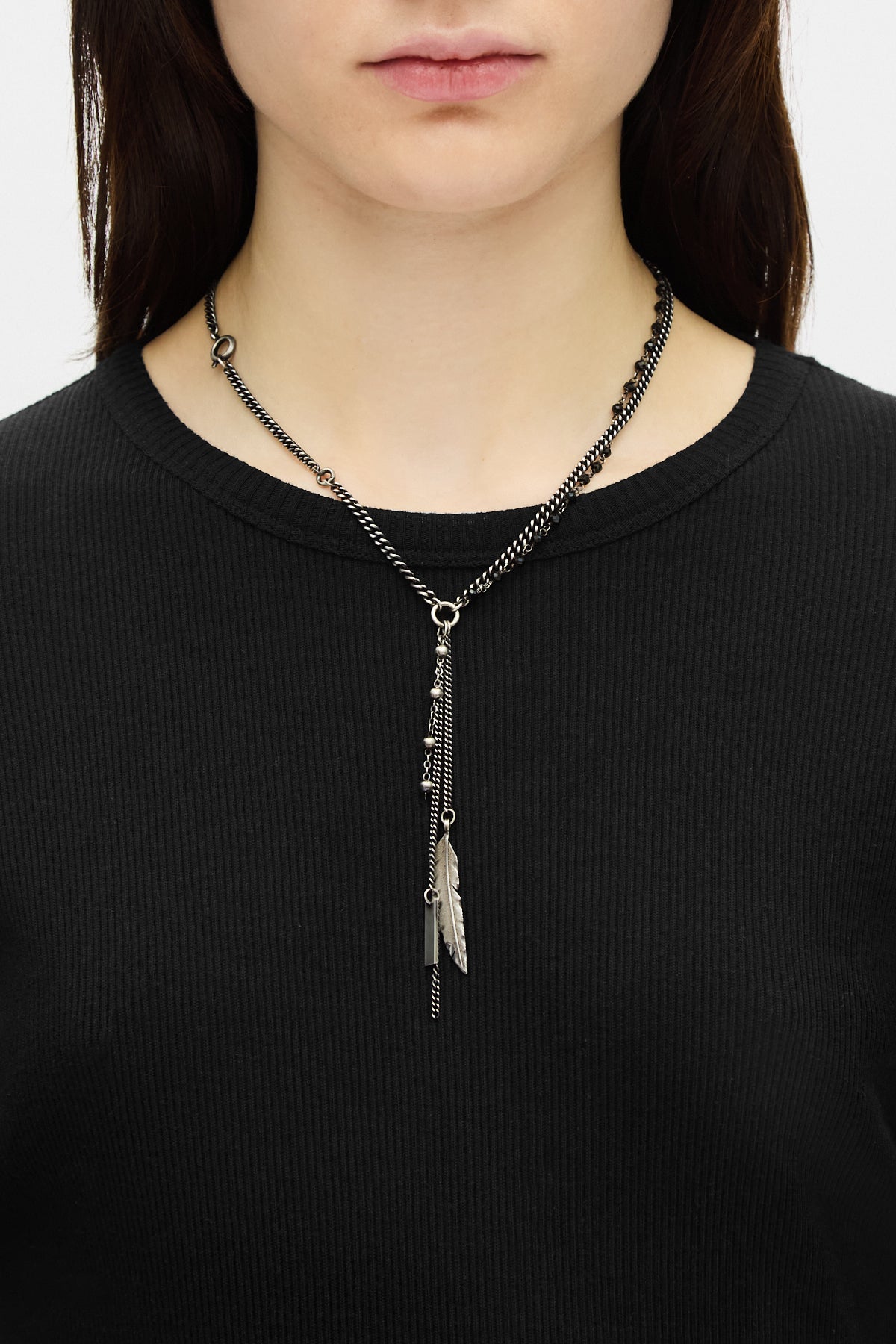 Necklace worn on black knit