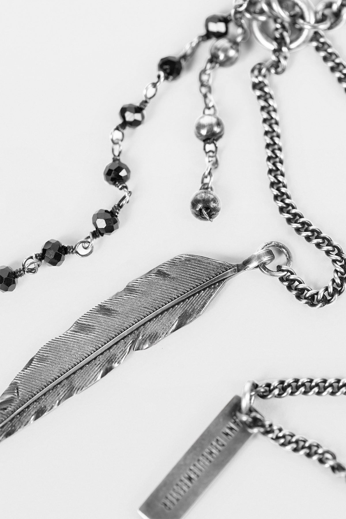 Close crop of feather charms