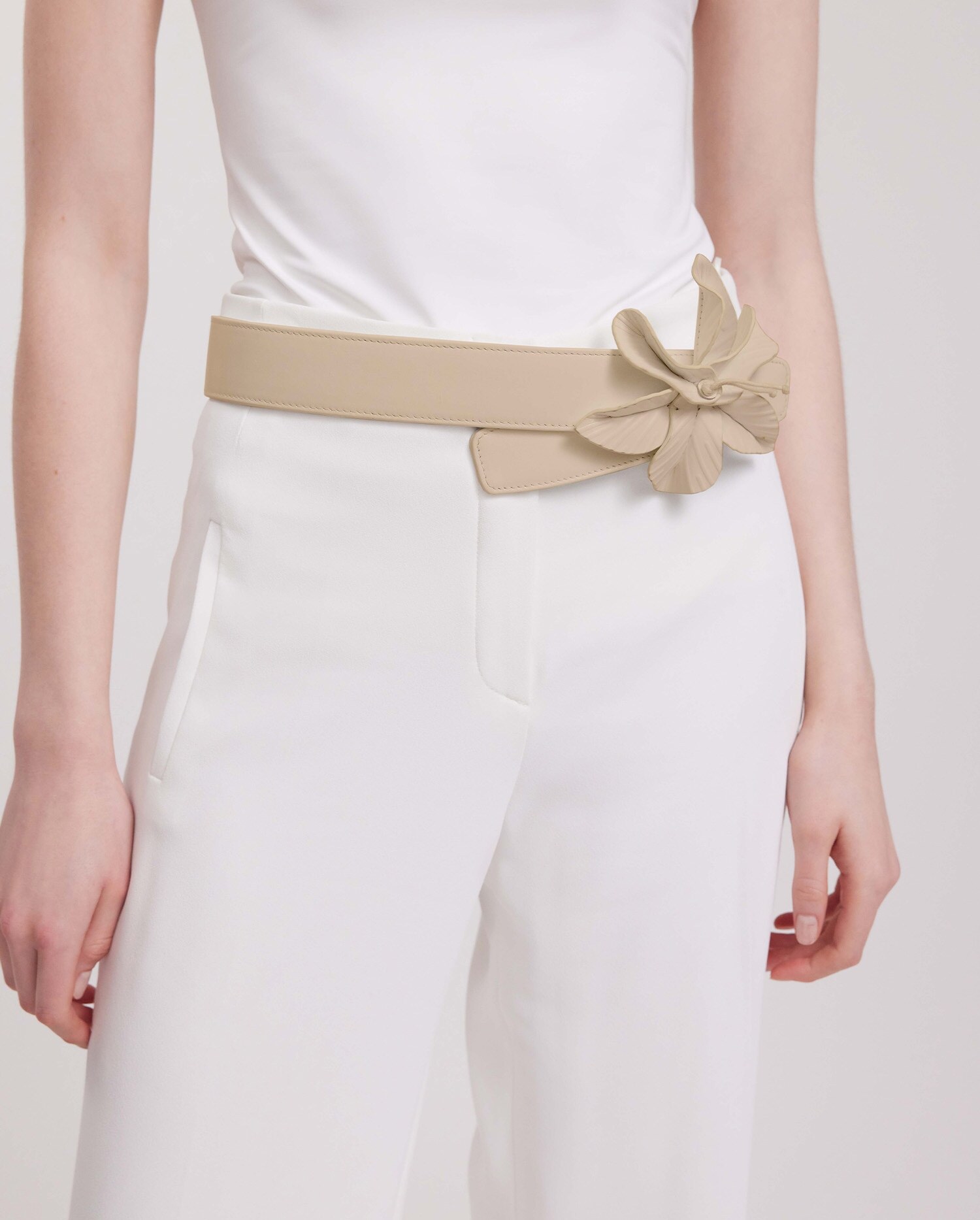 nude belt with flower detail