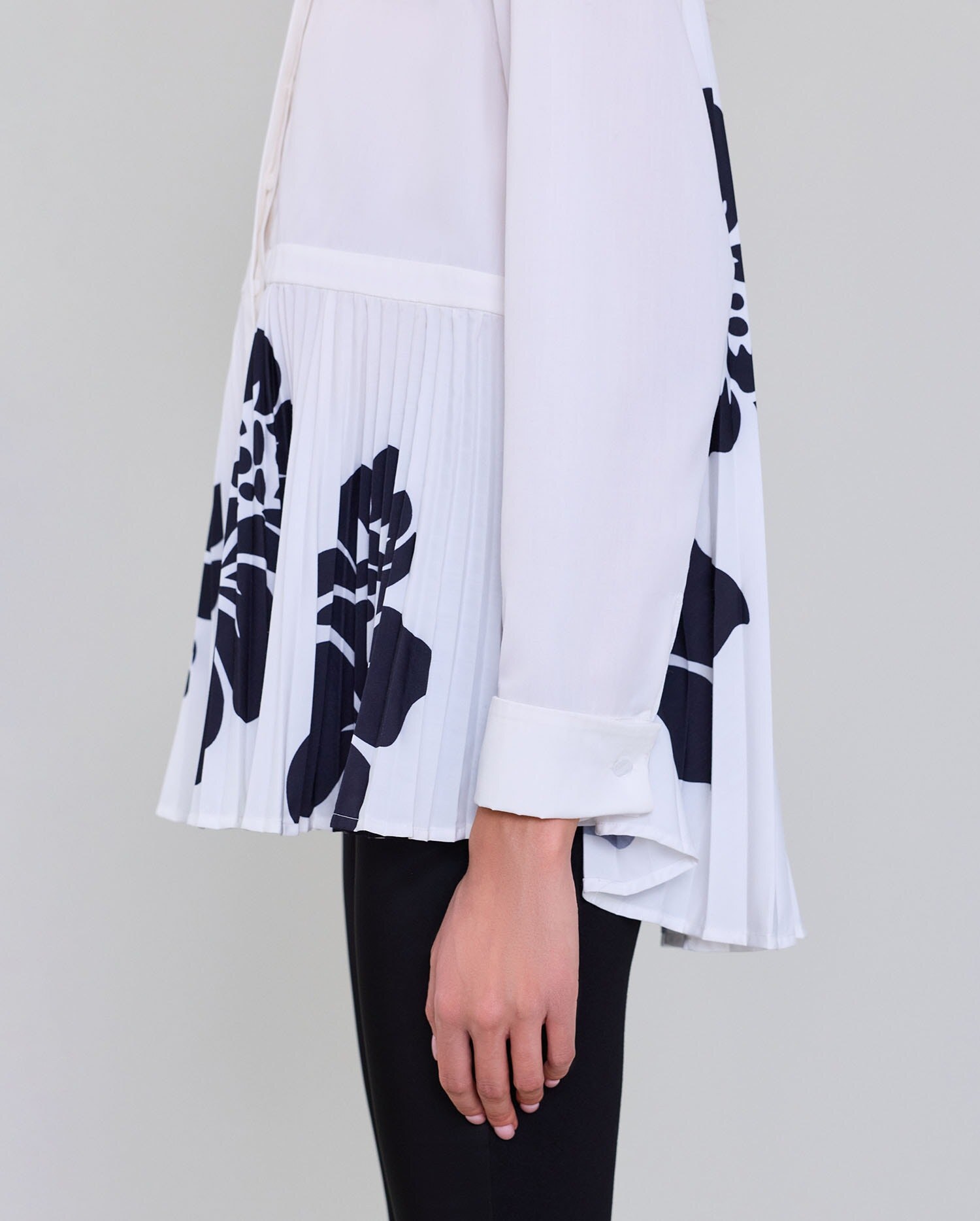 pleated hem and sleeve detail