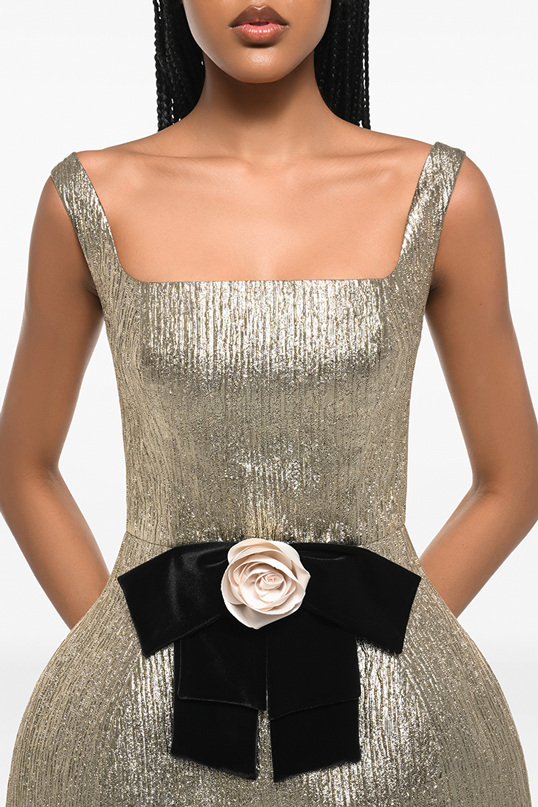 Three-quarter view with the sculpted rose appliqué