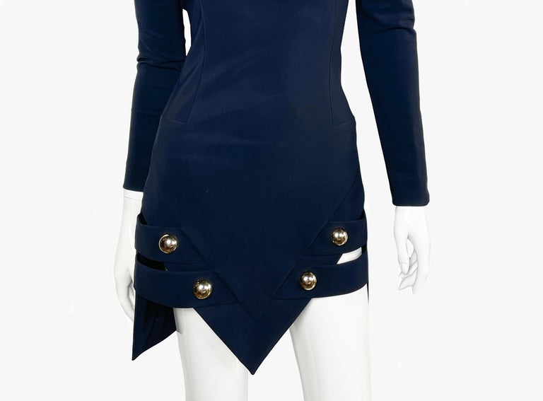 Detail view of the asymmetric skirt and buttons