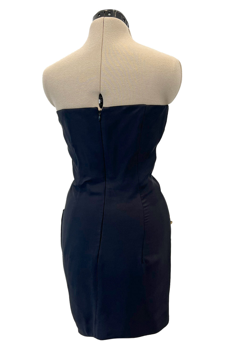 Three-quarter view showing the buttoned skirt detail