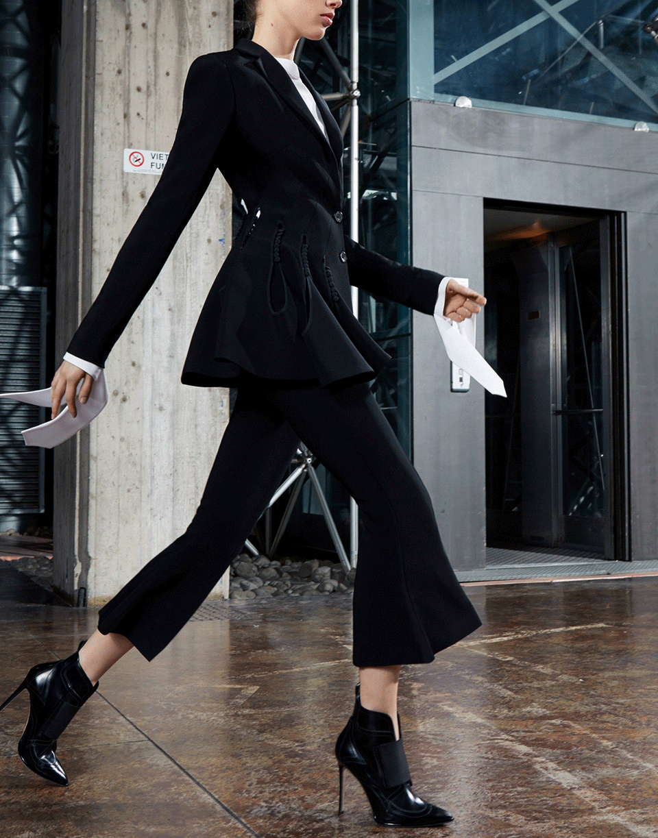 Styled with wide trousers for a full tailored look