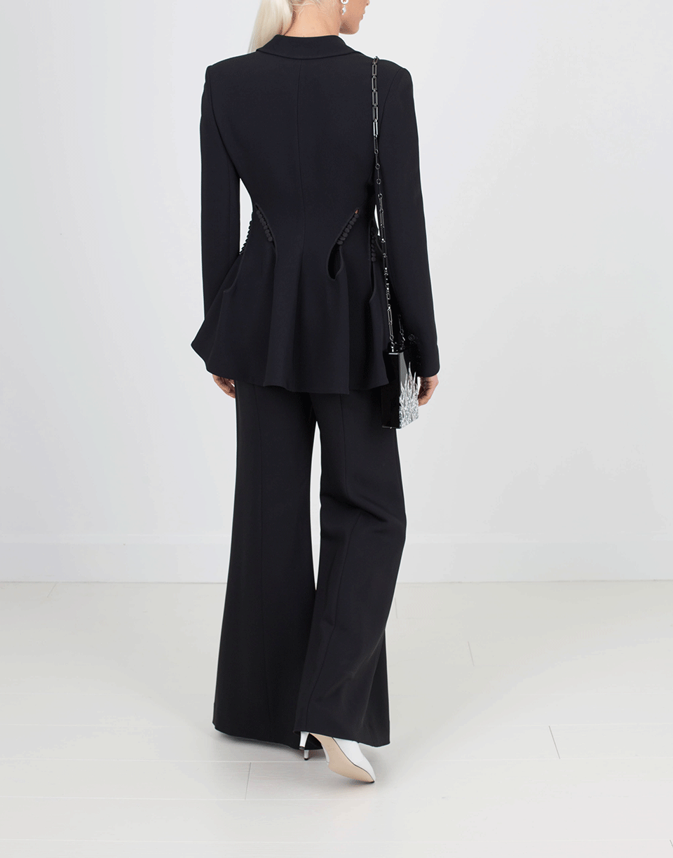 Movement shot emphasizing the peplum structure