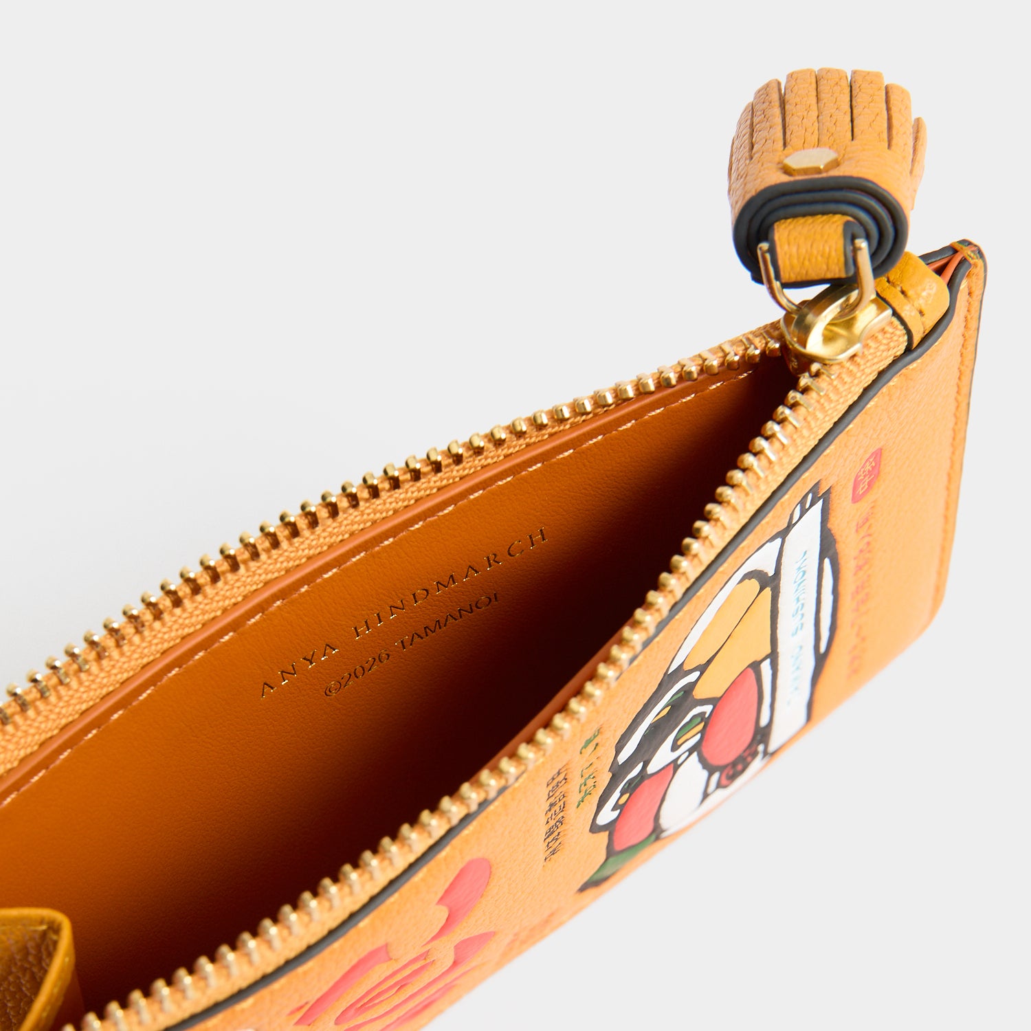 Side detail of the tassel zip pull