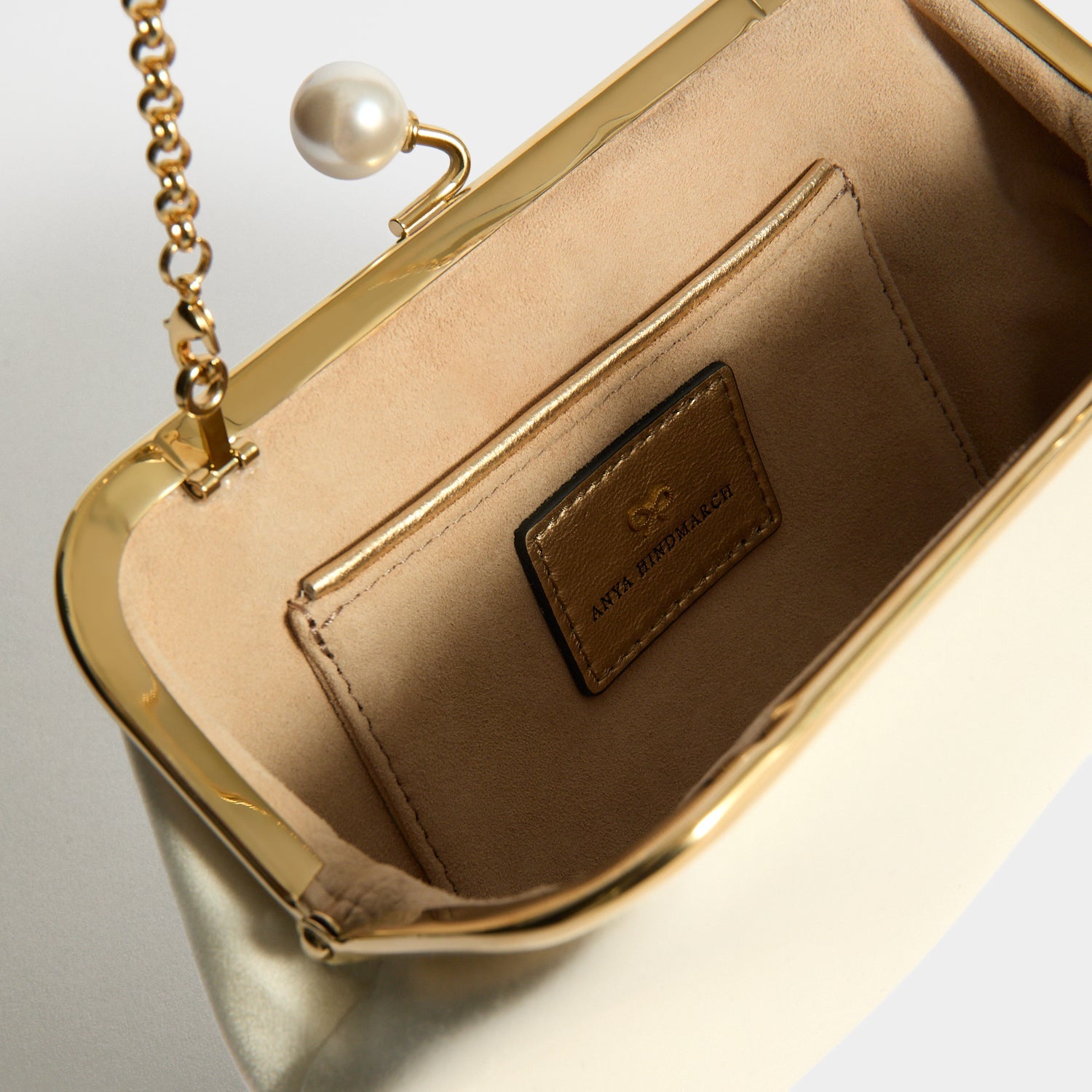 Chain strap tucked for clutch carry