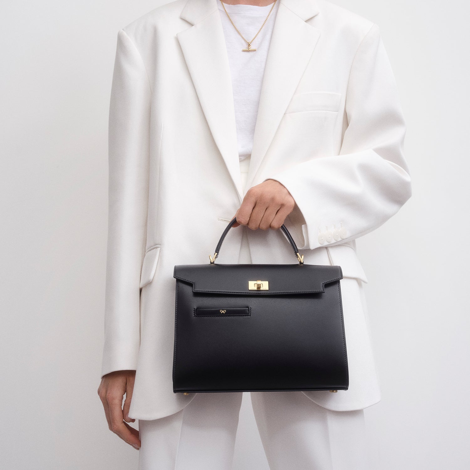 Model view with the top handle and long strap