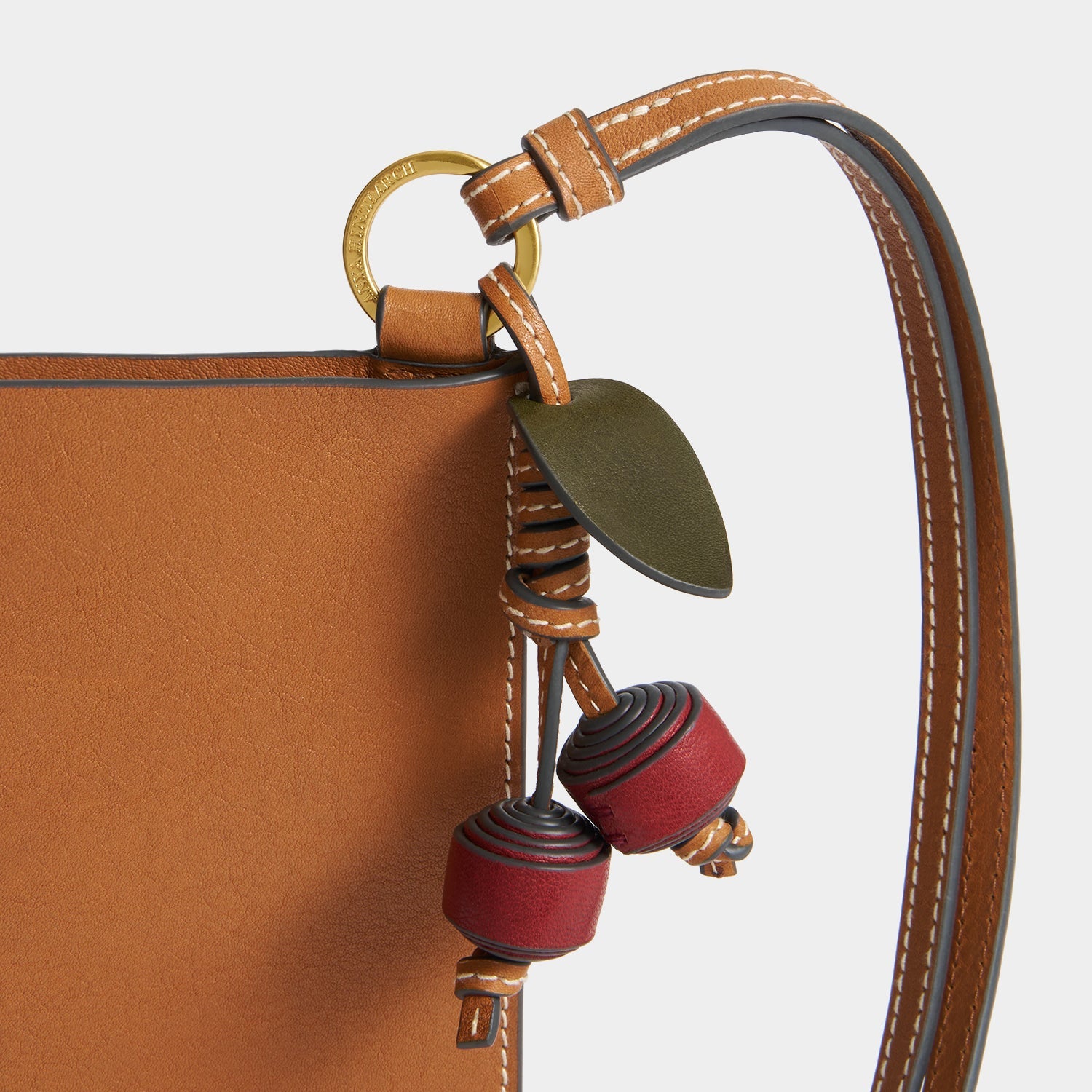 Cherry charm and strap detail