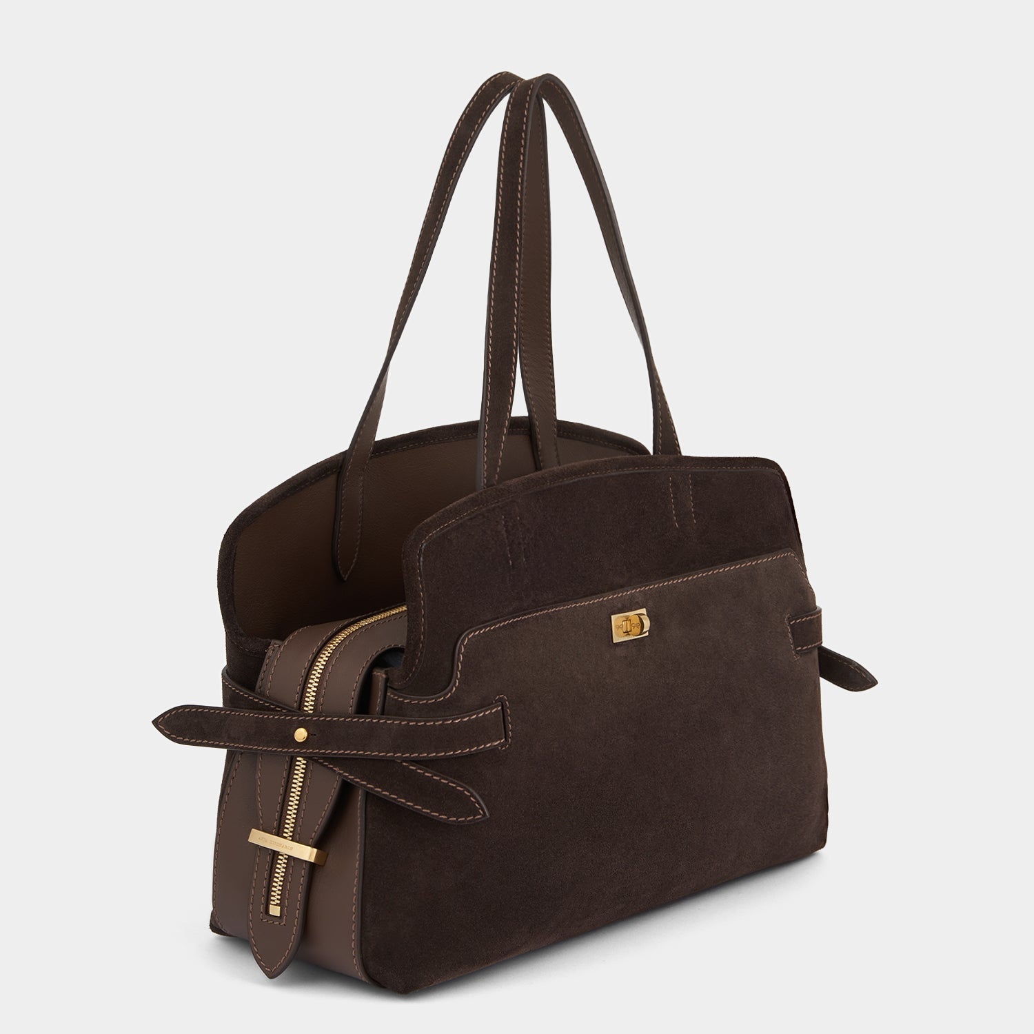 Angled view showing the suede-and-leather body