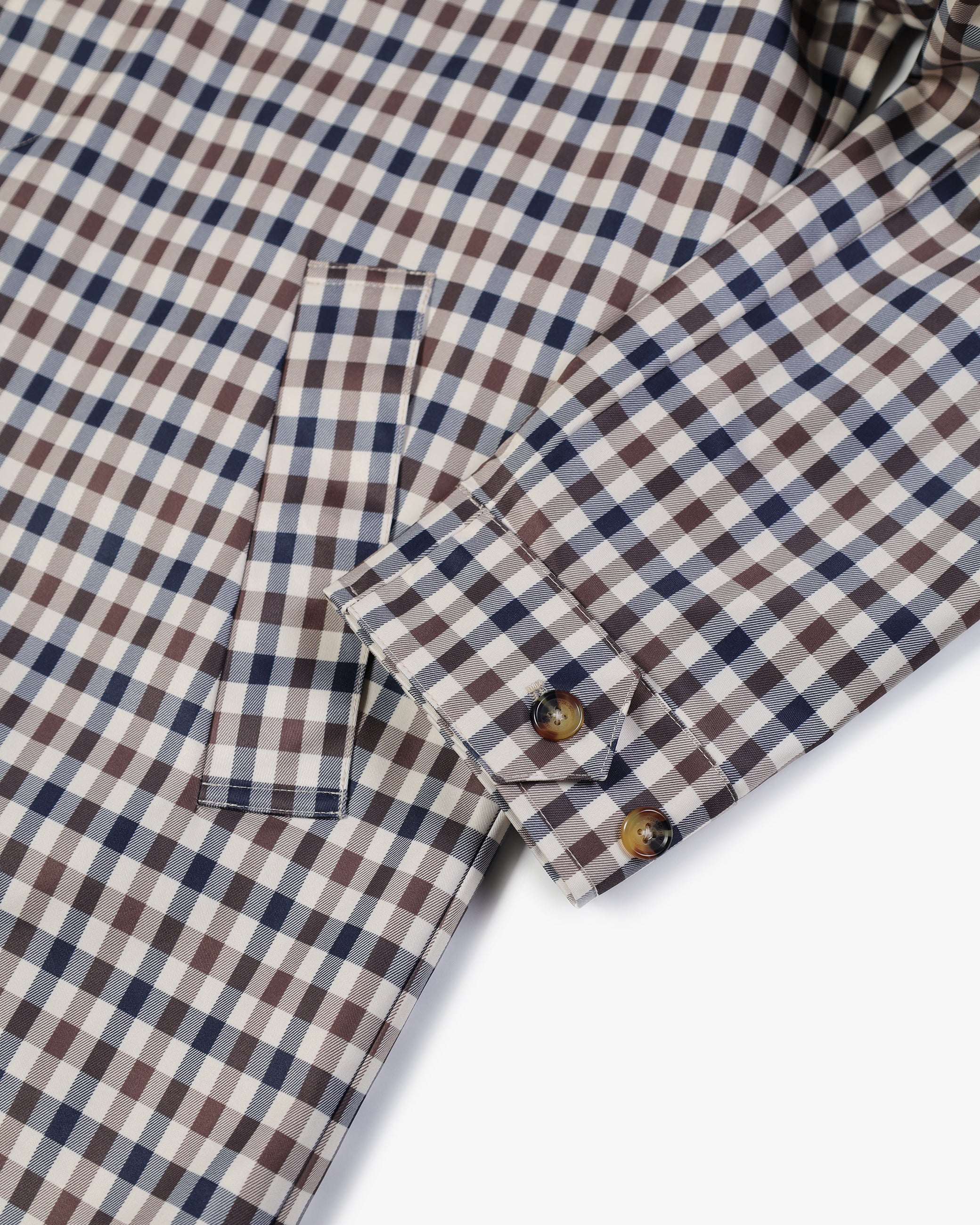 Collar and pocket detail in Club Check