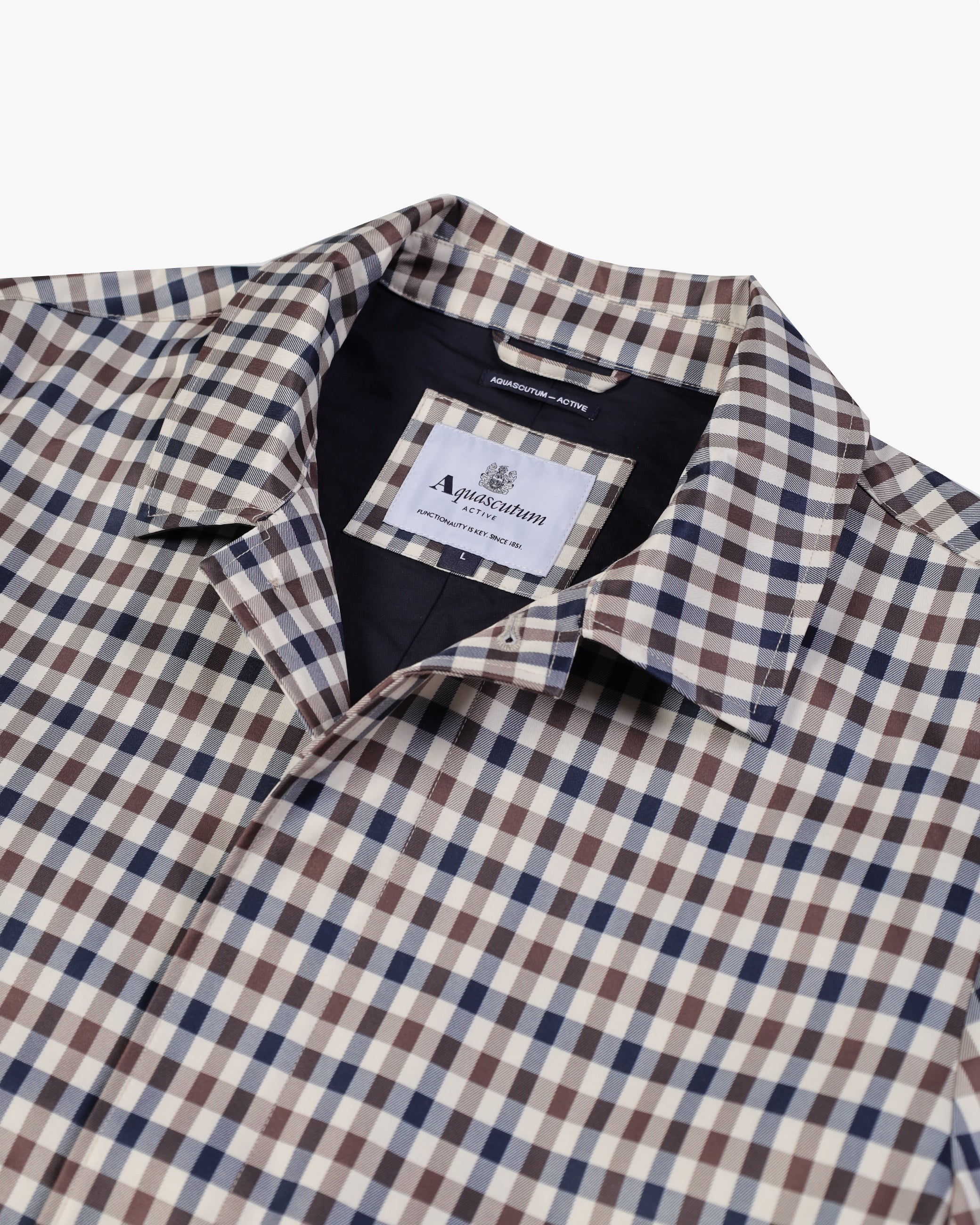 Closeup of check fabric and front hardware
