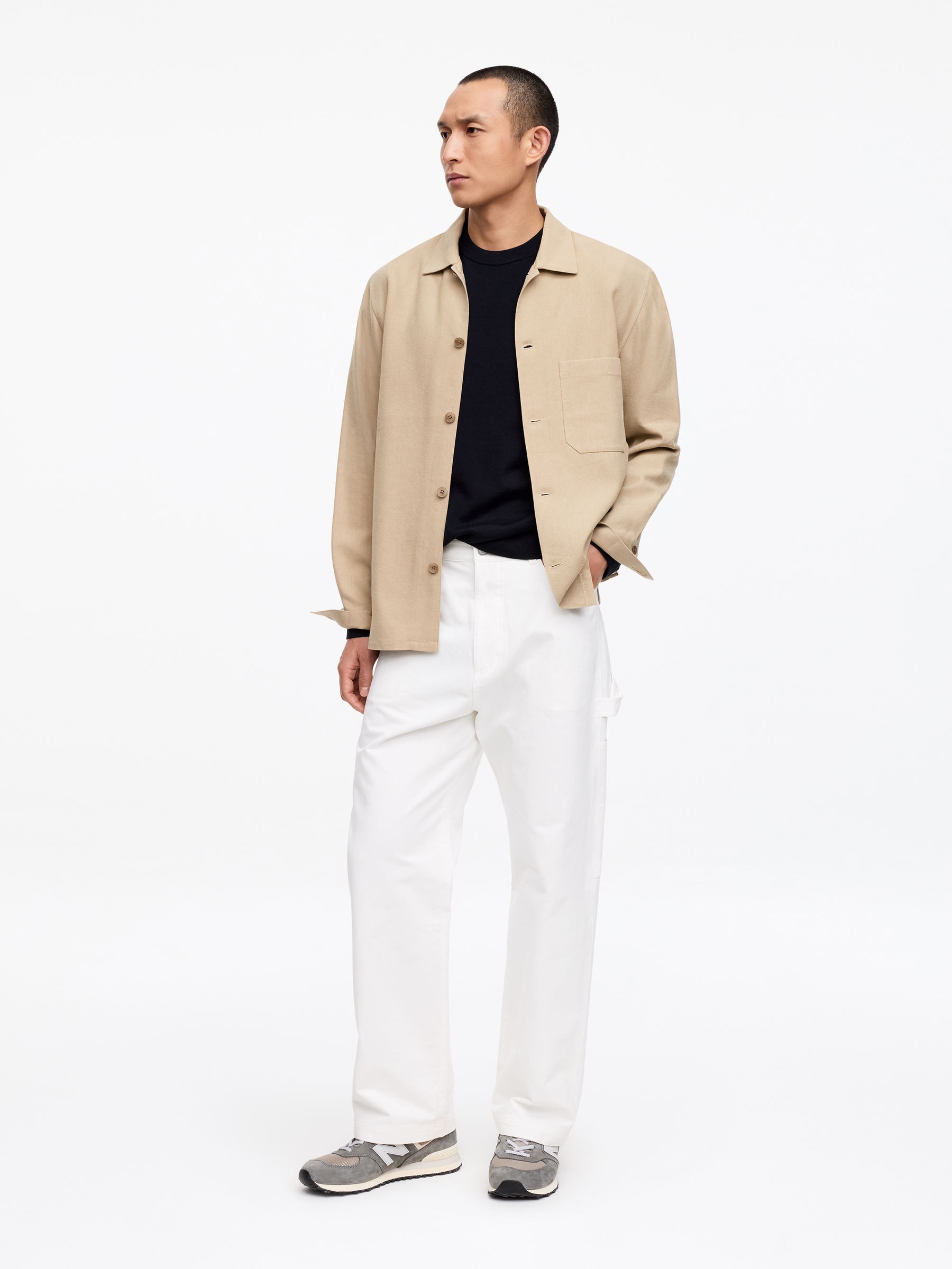 Styled under a beige overshirt