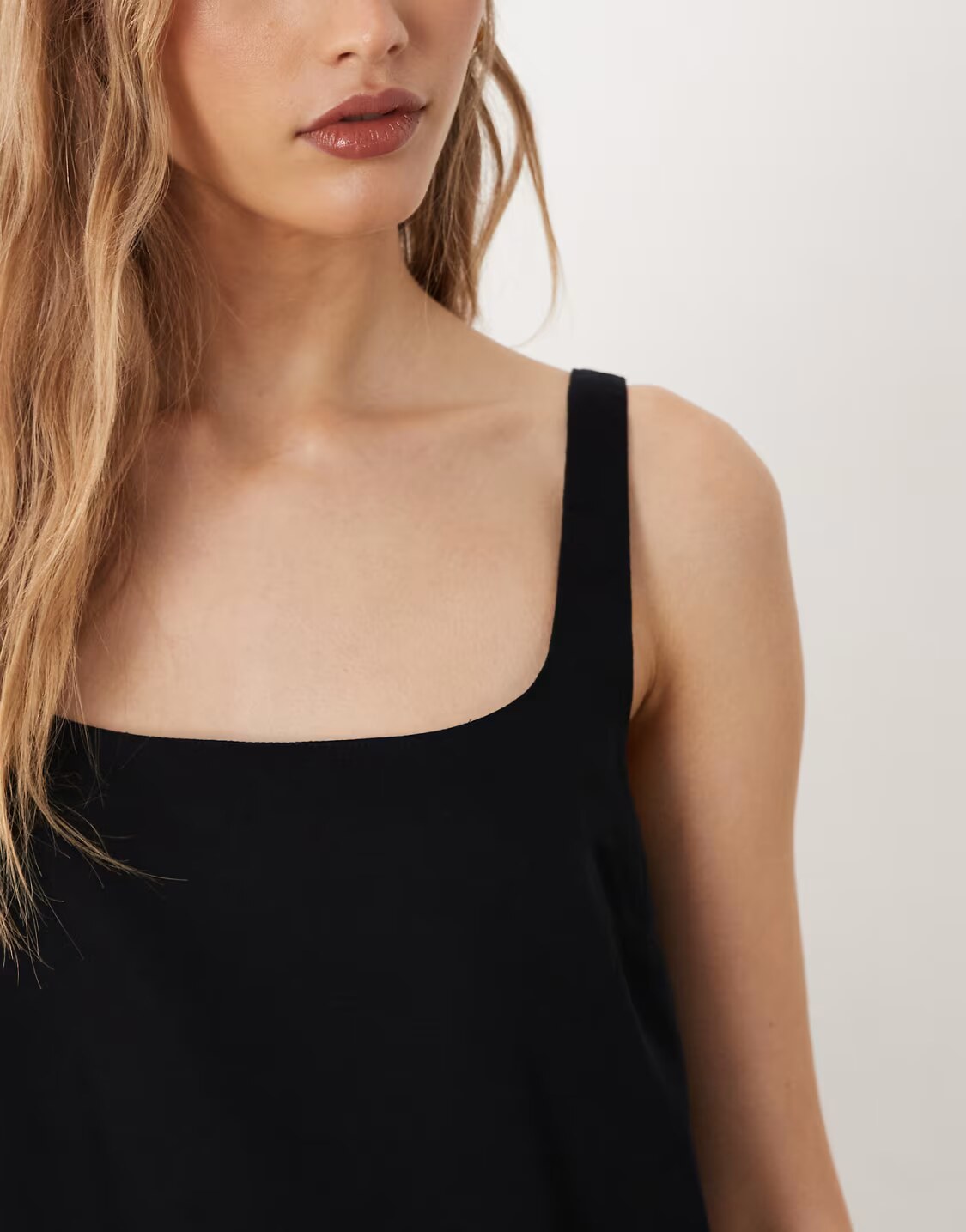 side profile and sleeveless cut