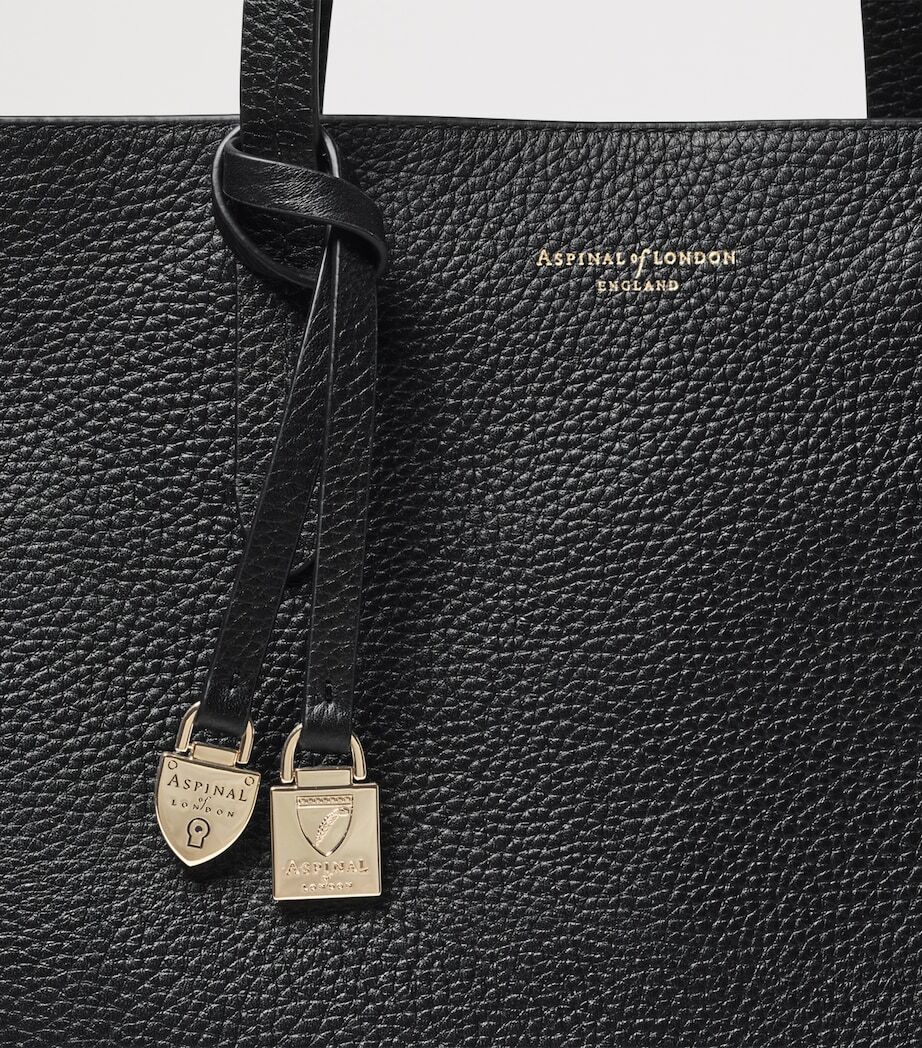 Black pebble charm detail