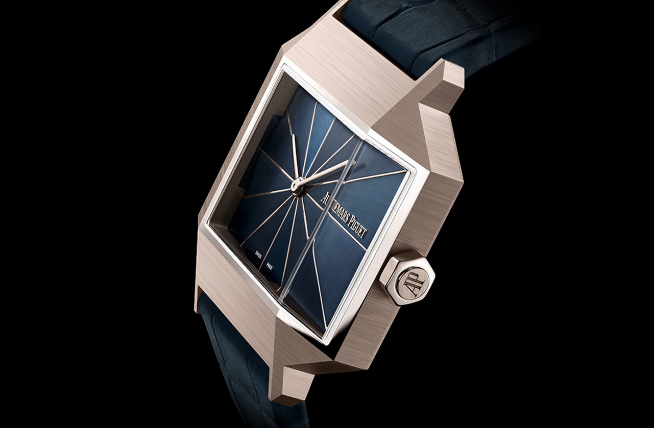 Side view showing the faceted sand-gold case and blue strap