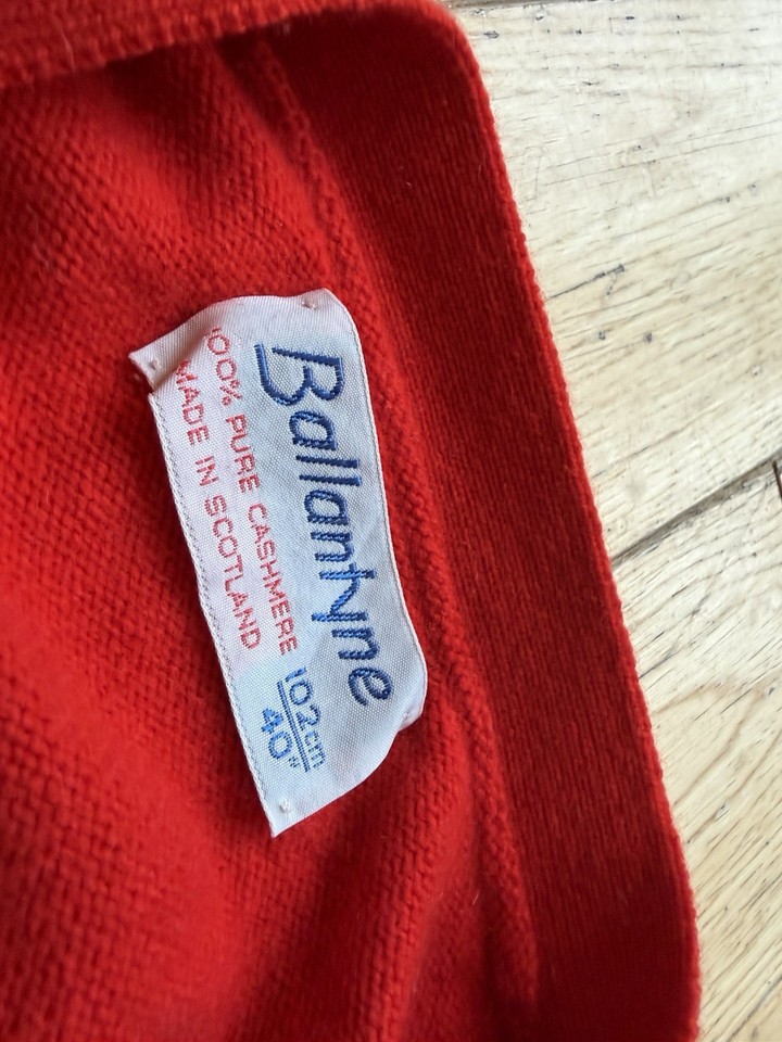 Label closeup on a red Ballantyne cardigan