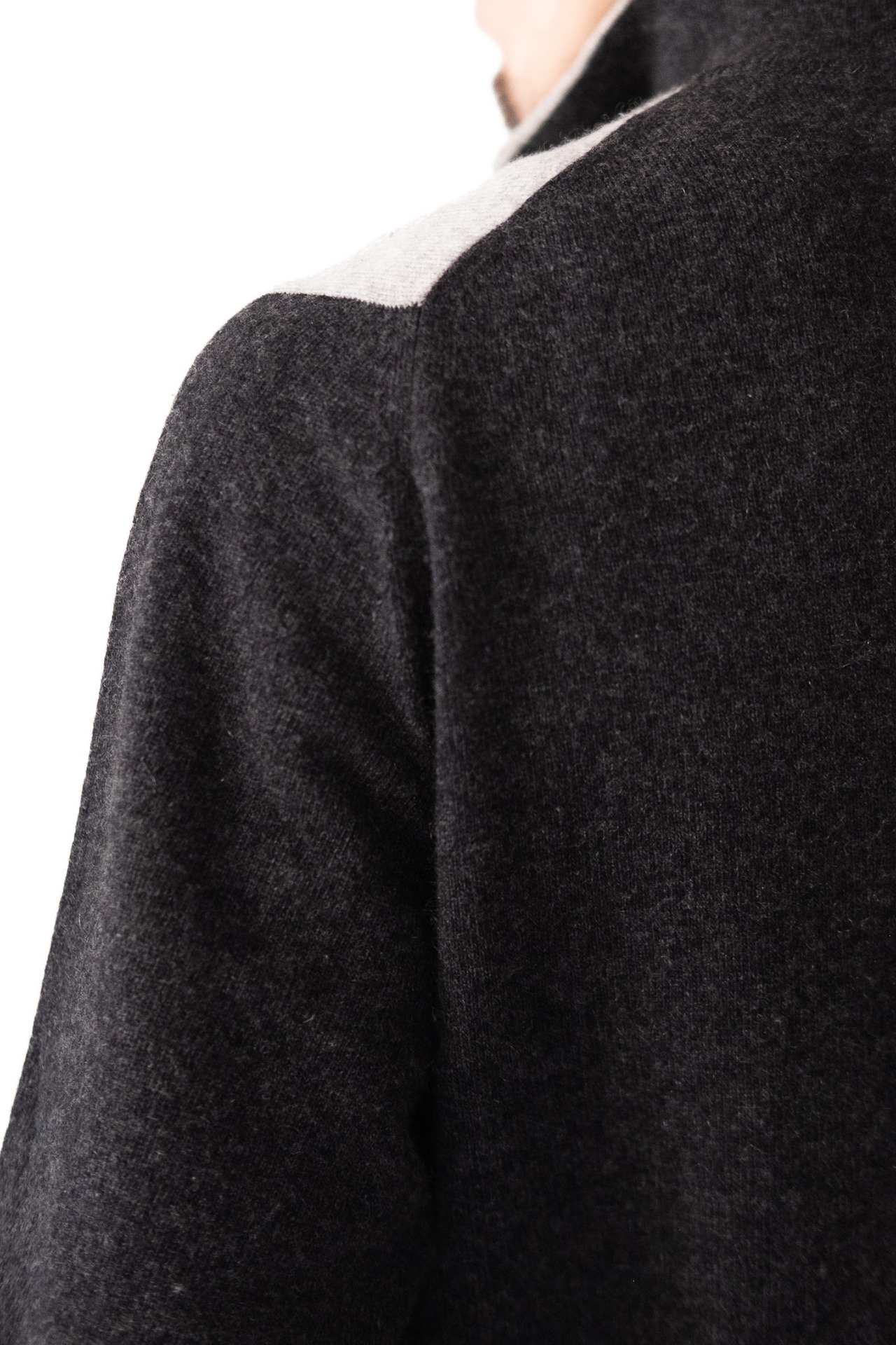 Close view of the zip collar and ribbed texture