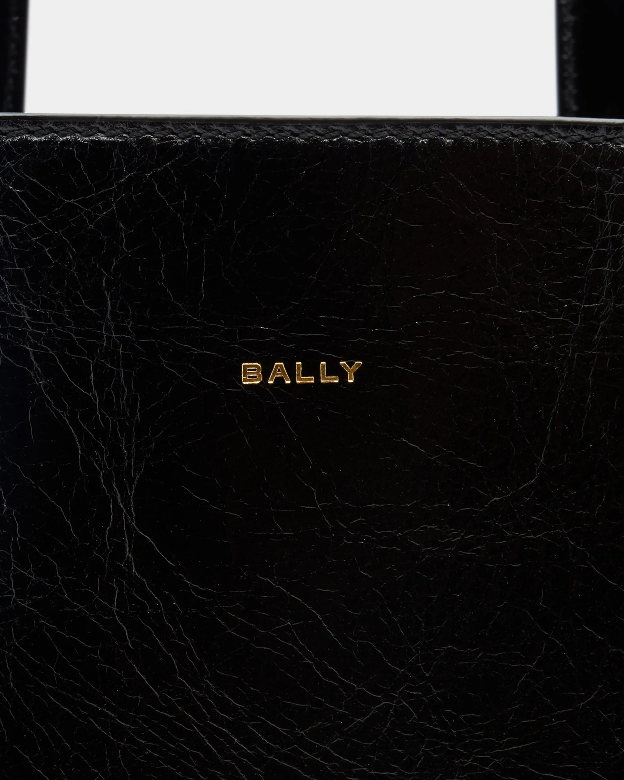 Close-up of gold-tone Bally logo