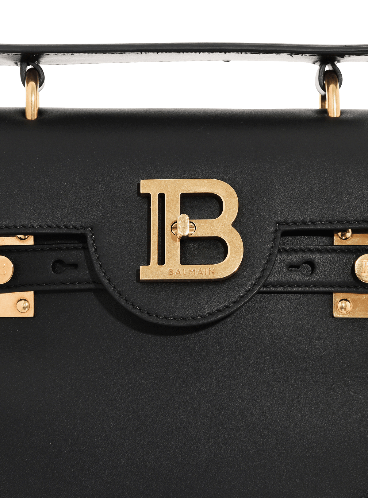 Detail of the gold interlocking B closure with the BALMAIN engraving