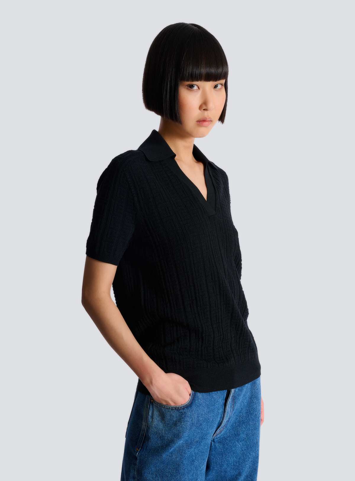 Three-quarter side view of the fitted knit