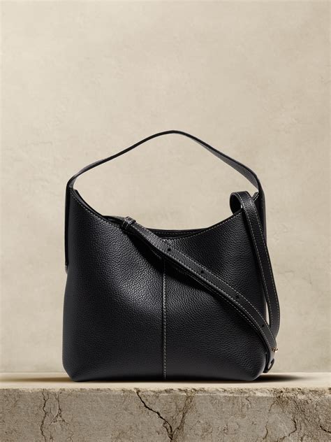 Slouchy side profile with shoulder strap