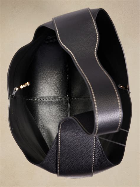 Worn on the shoulder with its relaxed body