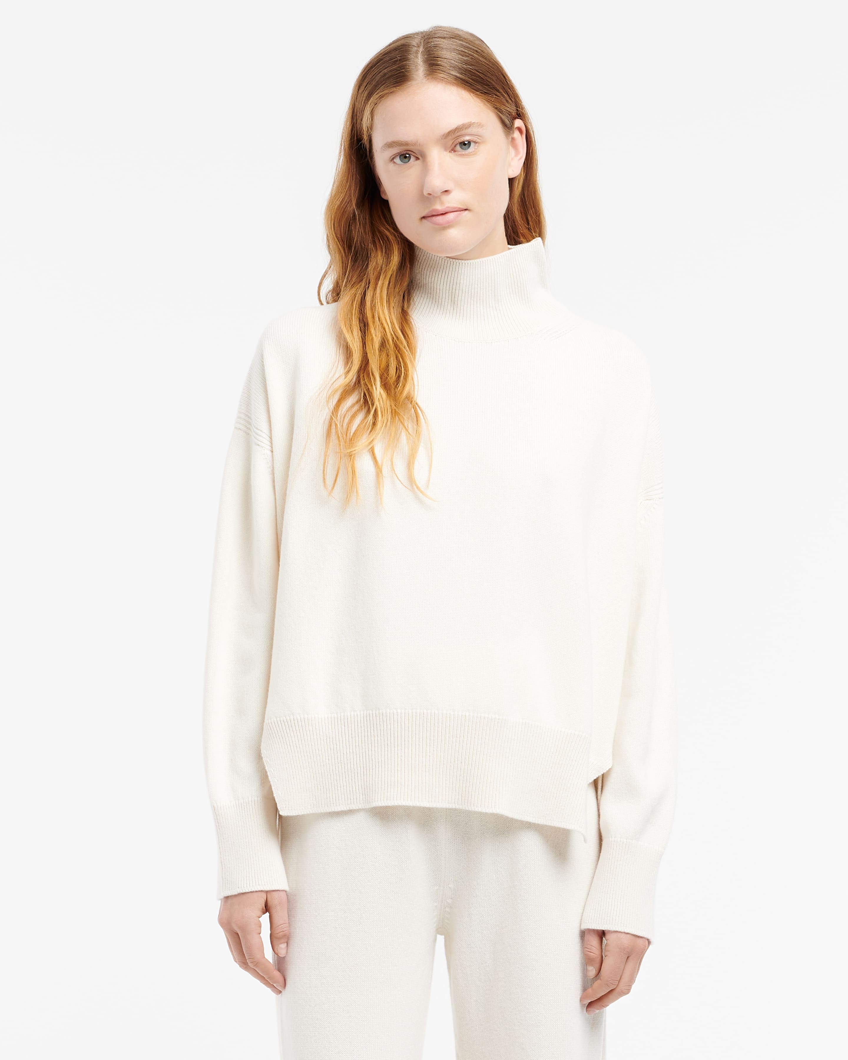 Iconic oversized roll-neck cashmere jumper — side profile