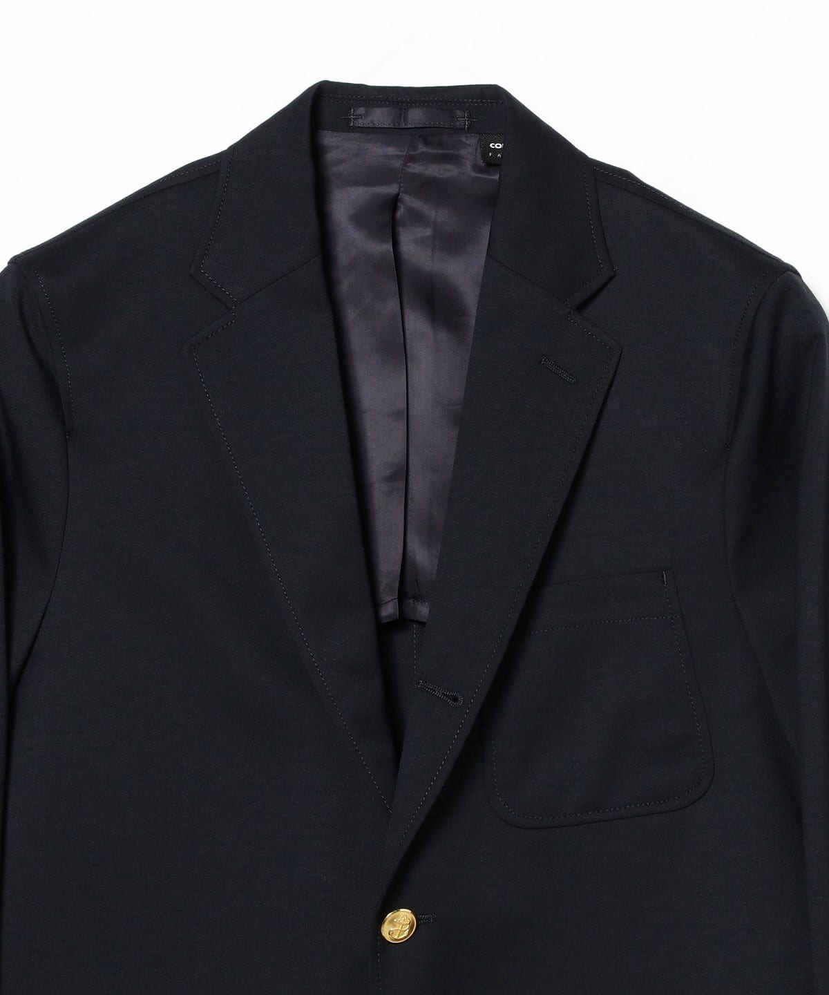 Lapel and gold-button detail