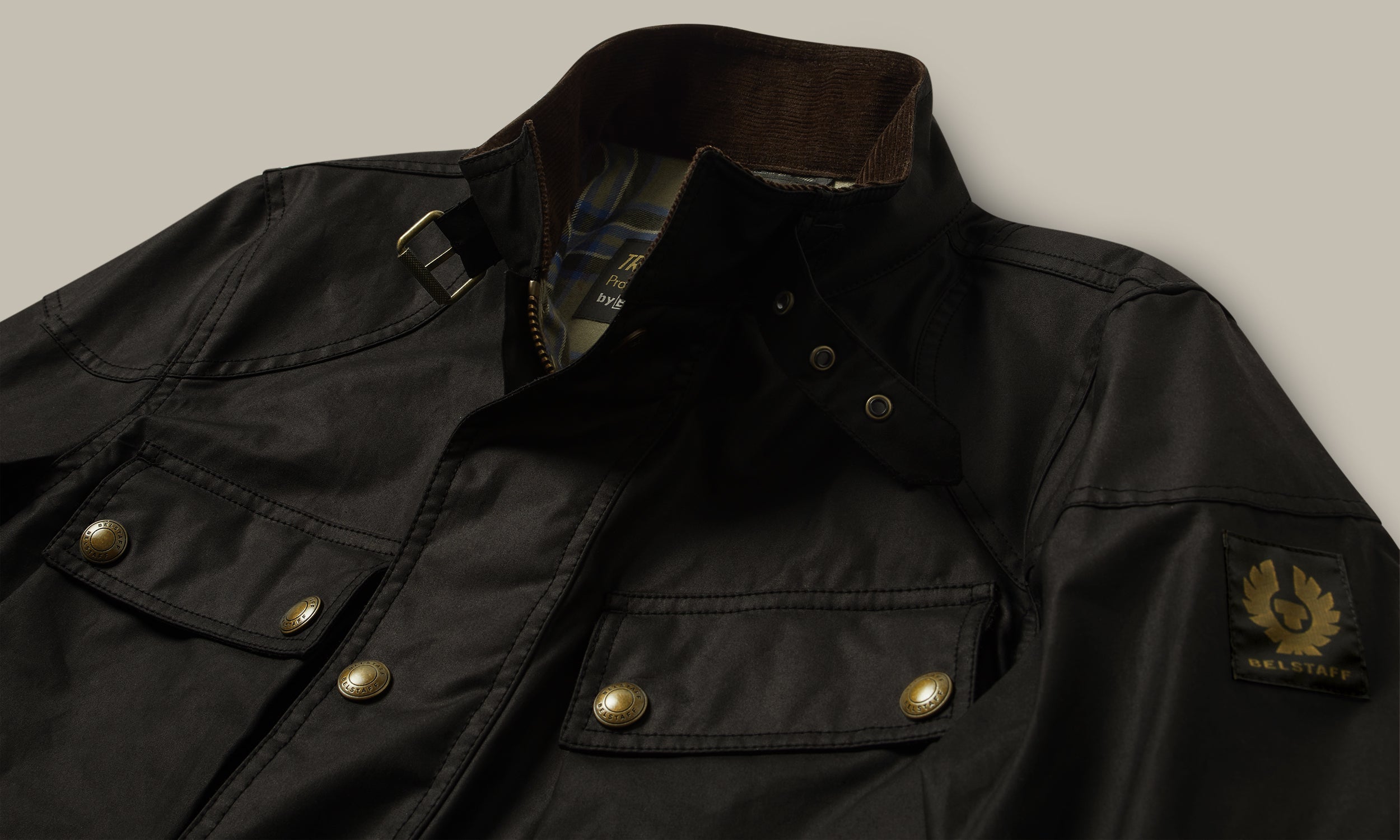 Buckle collar, studs and waxed cotton close-up.