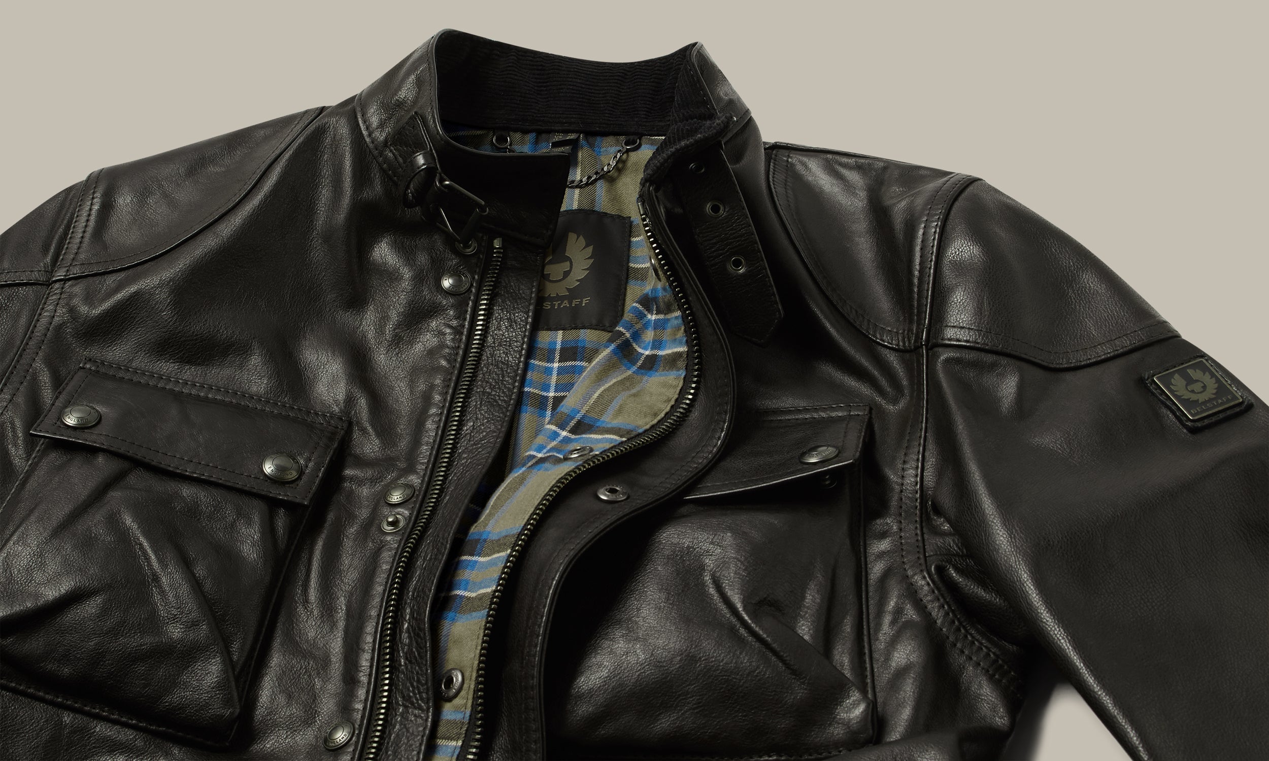 Leather collar and check lining close-up.