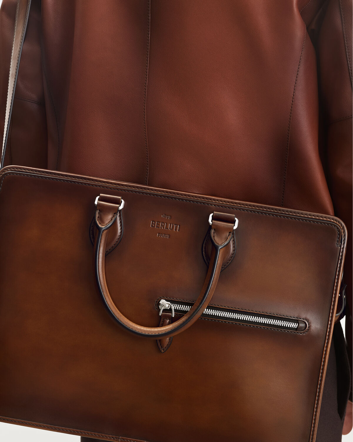 Close-up of patinated leather and zip