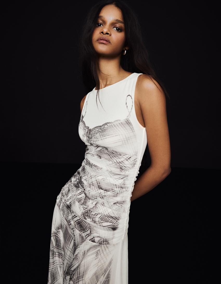 close crop of neckline and print