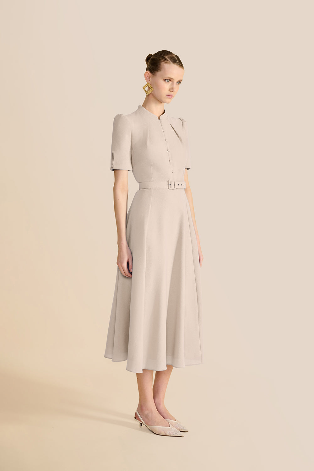 three-quarter view of the belted skirt