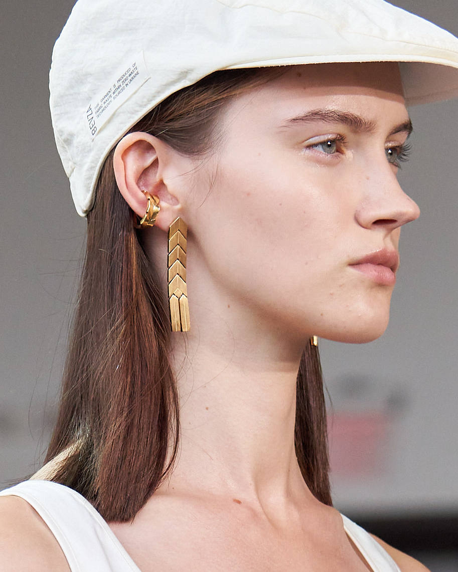 Earrings laid flat to show the wheat geometry
