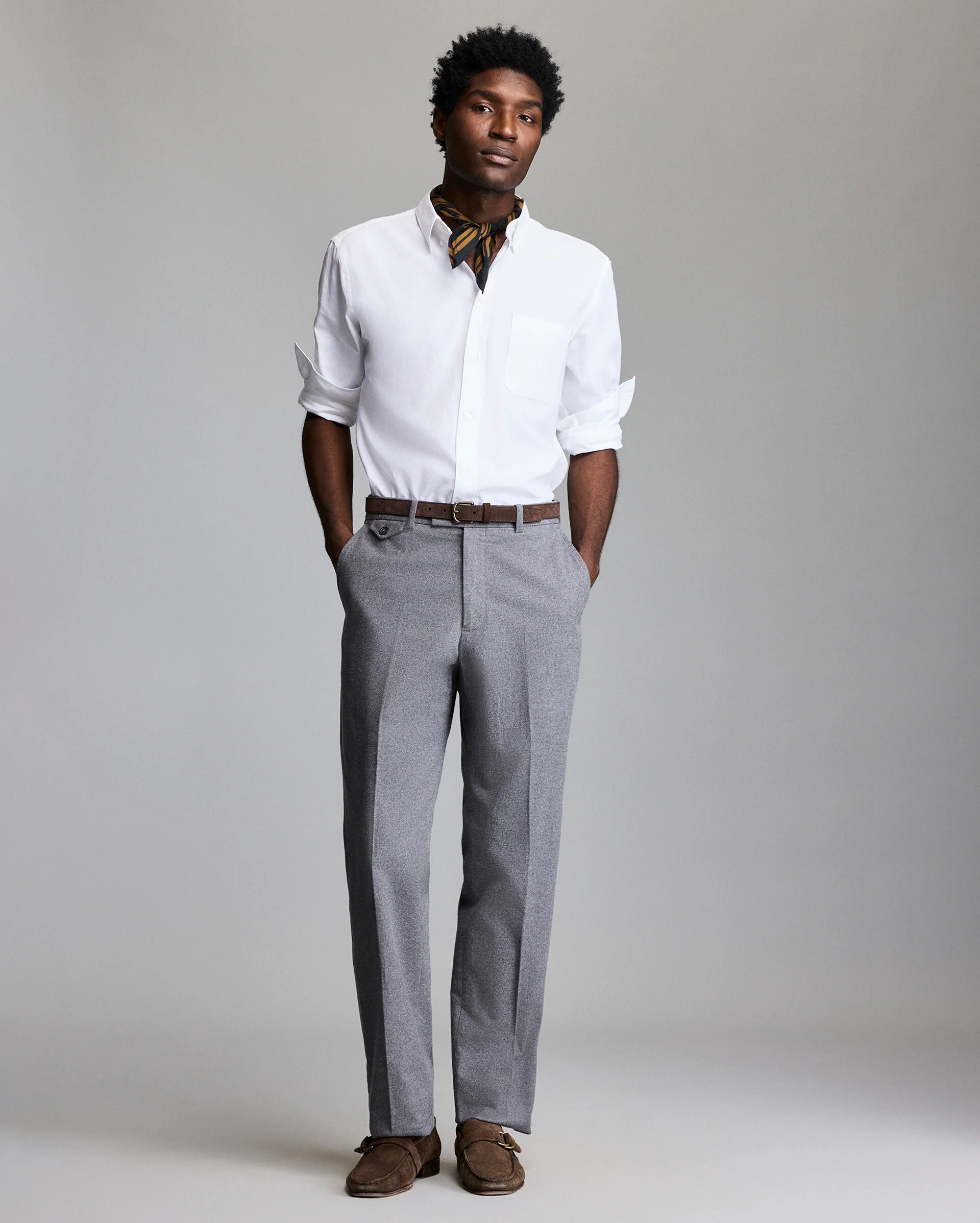 worn at the neck with a white shirt