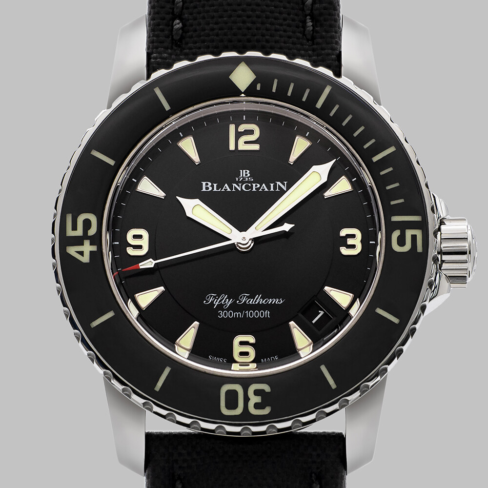 Clean product view of the black-dial Fifty Fathoms case and bezel