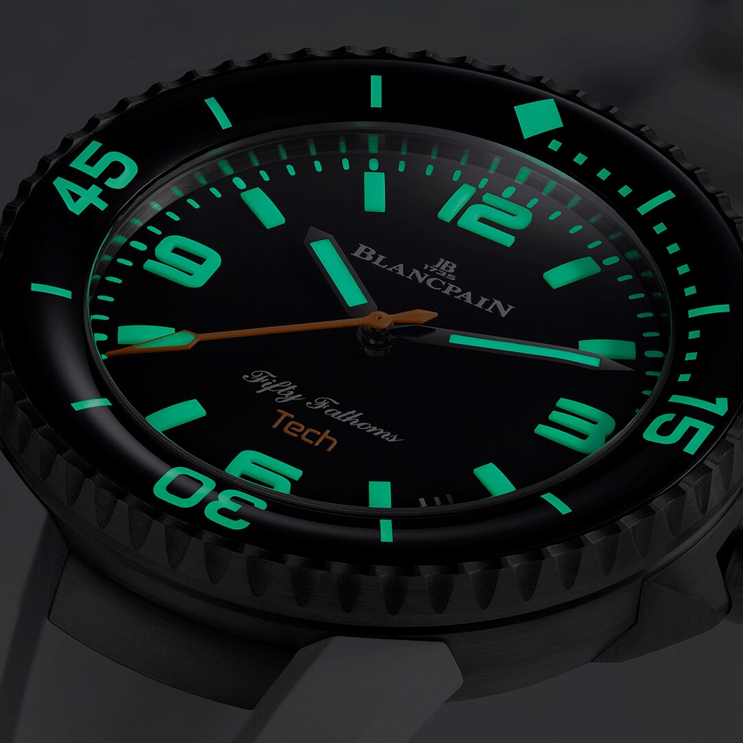 Luminous dial and bezel detail under low light